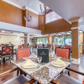 An elegant restaurant dining area with lavish decor and table settings.