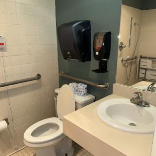 A clean and accessible bathroom setup with essential amenities.