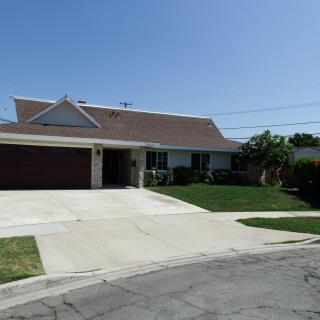 A suburban house with a driveway and garage.