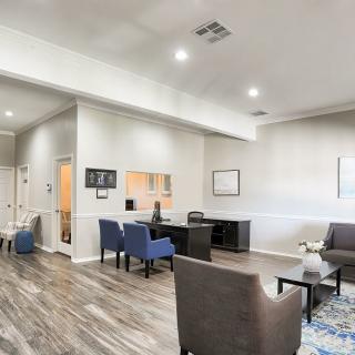 A modern office lobby with comfortable seating and stylish decor.
