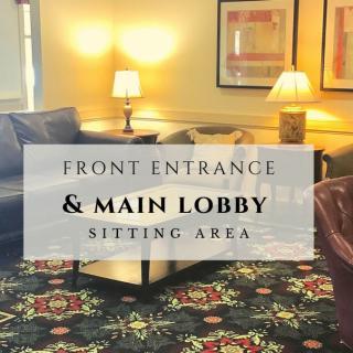 A cozy sitting area in the front entrance and main lobby of a hotel.