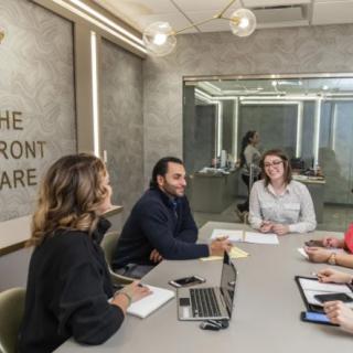 A team of professionals engaged in a meeting at the office.