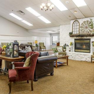 A cozy living room with comfortable seating and a fireplace.