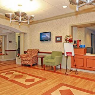 A welcoming lobby area with comfortable seating and a reception desk.