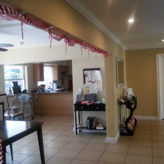 Open kitchen and dining area with festive decorations.