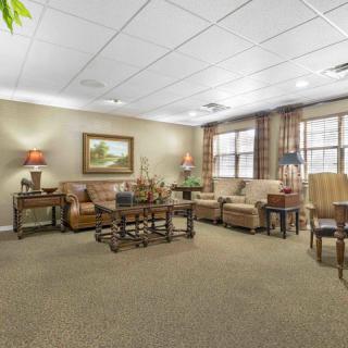 A cozy living room with comfortable seating and warm lighting.