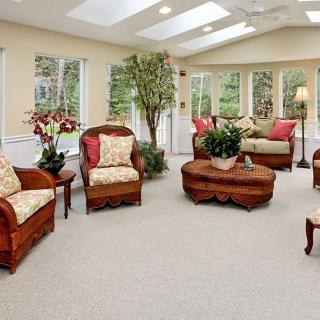 A cozy living room with comfortable seating and abundant natural light.
