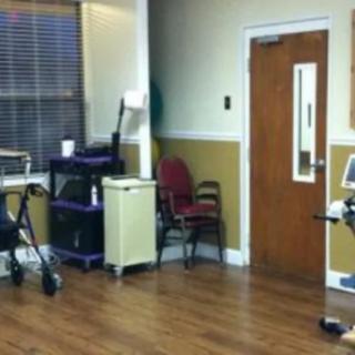 A hospital room with medical equipment and chairs.