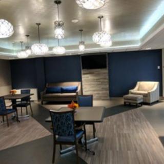 A modern lounge area with contemporary furniture and stylish lighting.