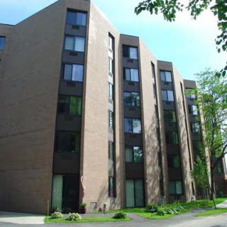 A modern residential building featuring a unique architectural design.
