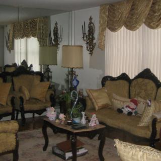 A classic living room with ornate furniture and decorative accents.