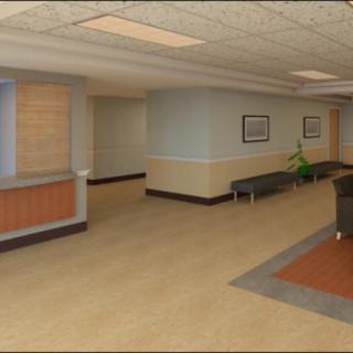 A hospital reception area with seating and a front desk.