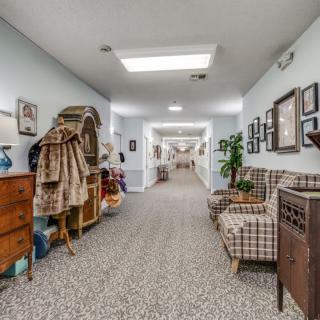A cozy hallway with furniture and decorative elements, showcasing a warm interior design.