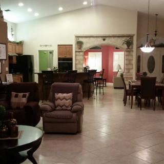 Spacious open floor plan featuring a cozy living room, modern kitchen, and elegant dining area.