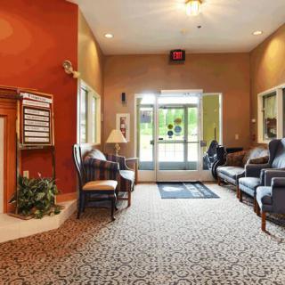 A cozy lobby with comfortable seating and warm lighting.