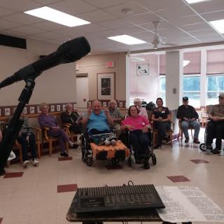 Residents of a care home gathered for a community event.