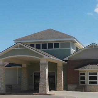 A modern residential building with a welcoming entrance and attractive architectural features.