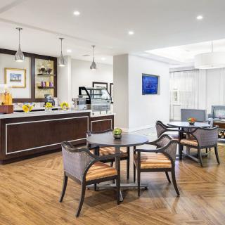 A modern caf interior with stylish furniture and elegant lighting.