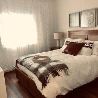A cozy bedroom with soft lighting and elegant decor.