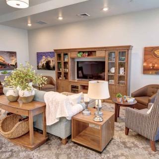 A cozy living room with modern wooden furniture and stylish decor.