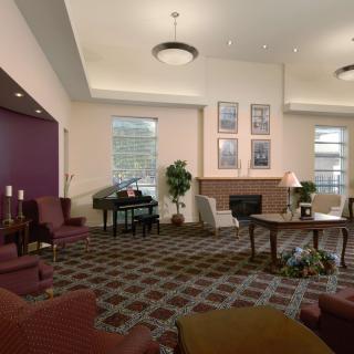 A spacious hotel lobby with comfortable seating and elegant decor.