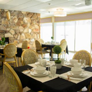 An elegant dining area featuring carefully arranged tables and stylish decor.