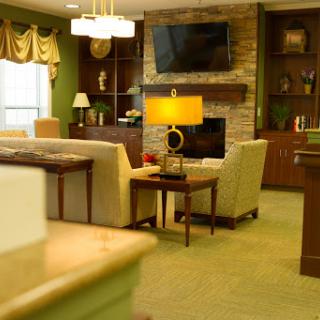 A cozy living room featuring a warm color palette, comfortable seating, and a welcoming ambiance.