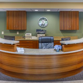 A modern reception desk in an office setting.