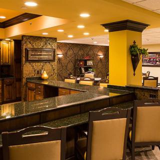 A well-lit hotel lobby with elegant decor and comfortable seating.