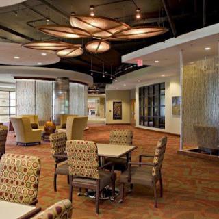A modern lobby featuring comfortable seating and stylish lighting.