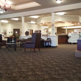 A spacious lobby area with comfortable seating and a welcoming reception desk.