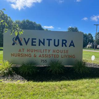 A sign for Aventura at Humility House, a nursing and assisted living facility.