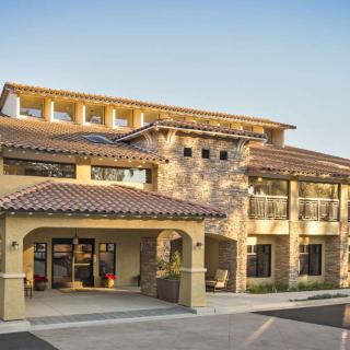 A modern residential building with a Mediterranean architectural style.