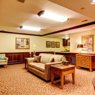 A cozy living room with comfortable seating and warm lighting.
