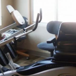 A workout room featuring an exercise bike.