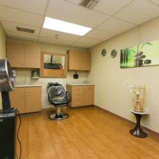 A well-organized hair salon with modern decor and a comfortable styling chair.