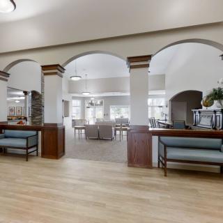 Spacious lobby area with archways and seating arrangements.