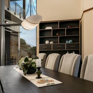 A modern dining room with elegant decor and a minimalist aesthetic.