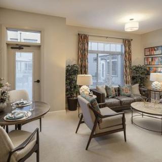 A stylish and modern living room with comfortable seating and elegant decor.