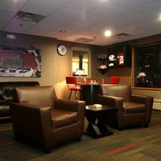 A cozy lounge area featuring comfortable chairs and ambient lighting.