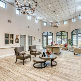 Spacious lobby with modern seating and large windows allowing natural light.