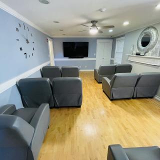 A modern living room with gray sofas and a TV.