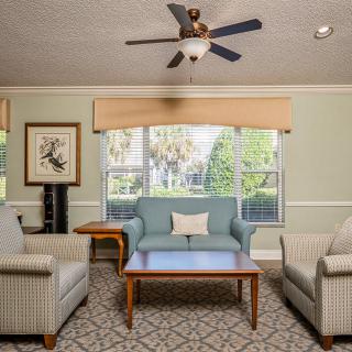 A cozy living room with comfortable seating and a classic design.