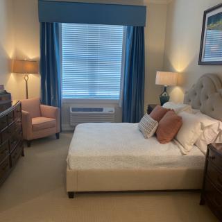 A cozy bedroom with elegant decor and furnishings.