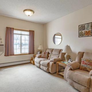 Cozy living room with comfortable sofas and warm decor.