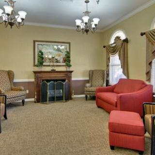 A cozy living room with comfortable seating and a fireplace.