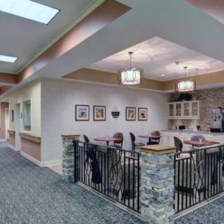 A well-lit office lobby with seating area and decorative elements.