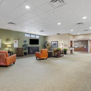A spacious and well-lit lobby with comfortable seating and a reception area.