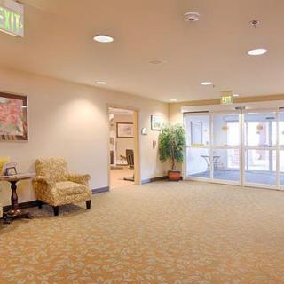 A well-lit, spacious lobby area with seating arrangements and decor.