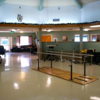 A rehabilitation center with exercise equipment for physical therapy.